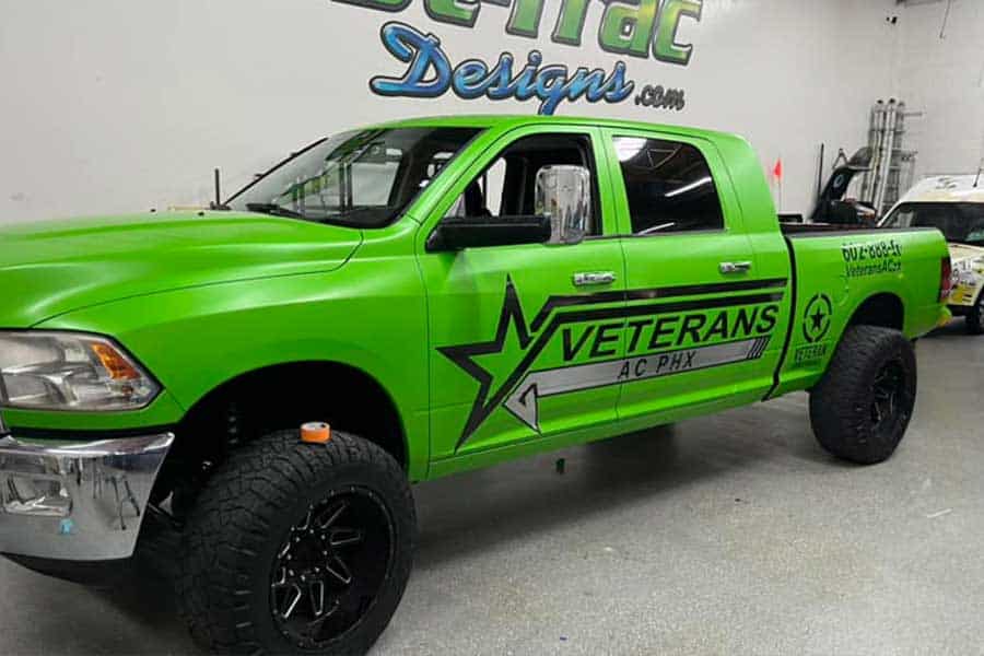 Bright green Veterans AC PHX service truck with custom wrap