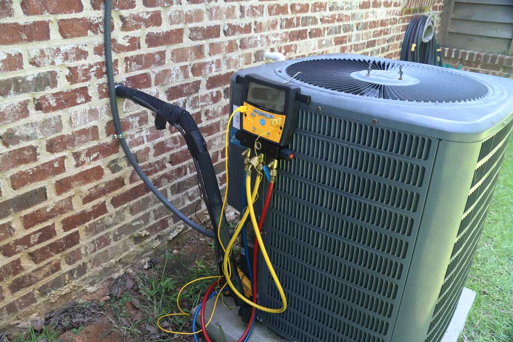 HVAC unit with diagnostic gauges attached during servicing