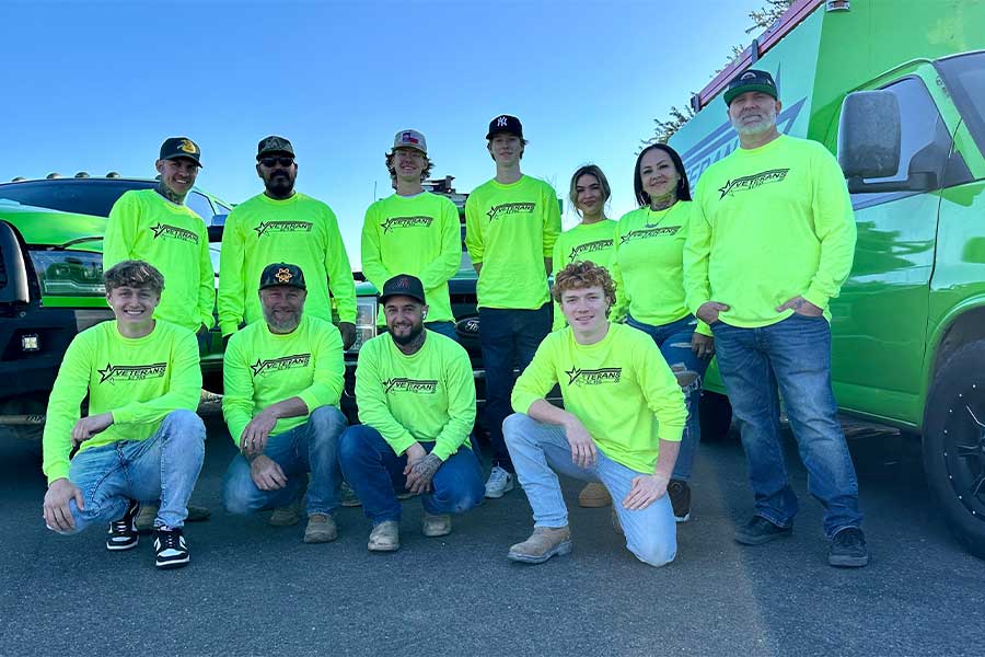 Veterans AC PHX team posing in bright neon green shirts