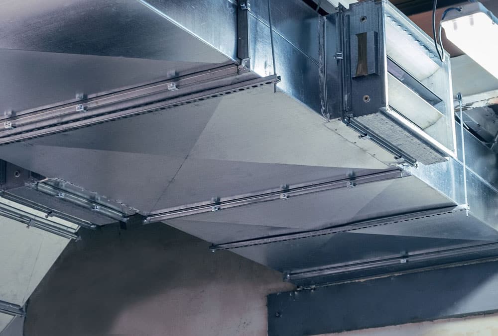 Metal HVAC air ducts installed on a commercial ceiling