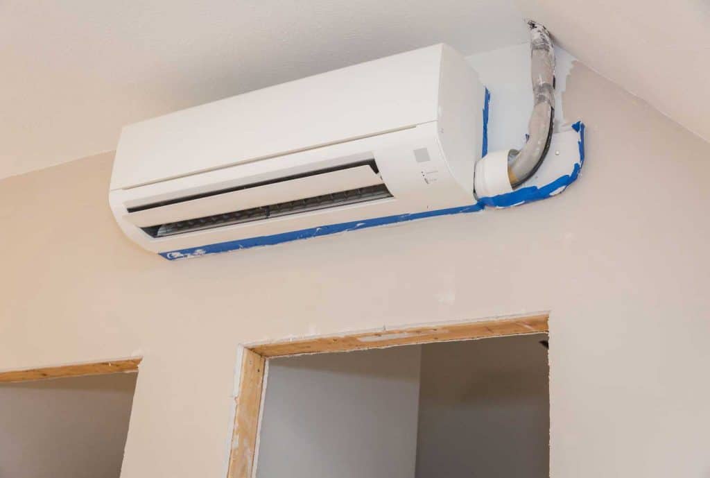 Ductless mini-split air conditioner installed on an interior wall