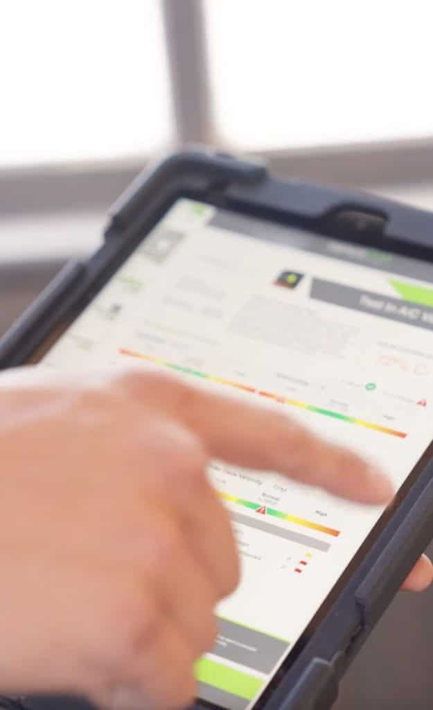 Person using a tablet to review HVAC data