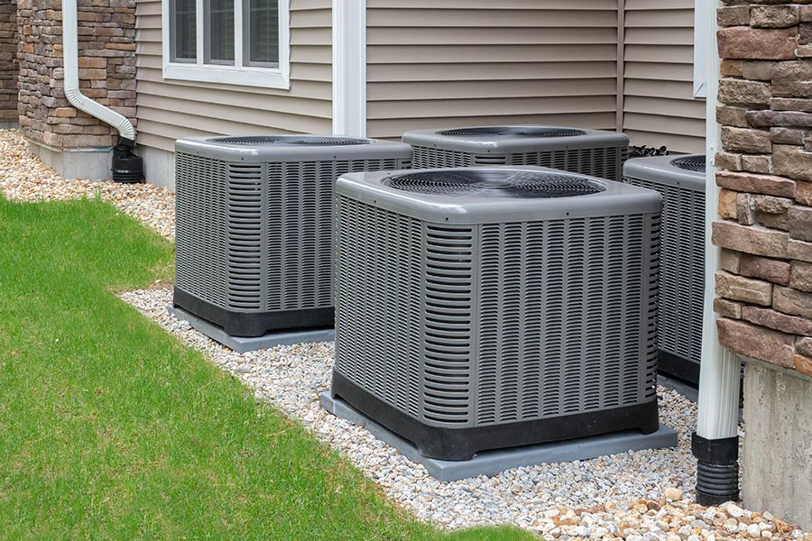 Outdoor air conditioning units next to a house